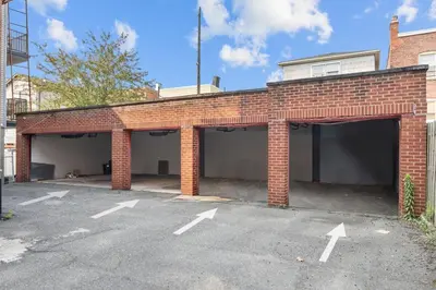 an empty parking lot in a brick garage at Modern Studio - Parking Available - 15 min NYC in Jersey City