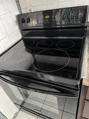 an oven with its door open in a kitchen at Classic king and queen suite in Schenectady