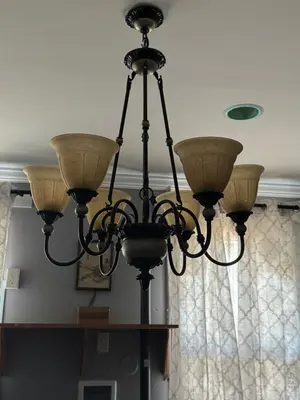 a chandelier hanging from the ceiling in a room at Classic king and queen suite in Schenectady
