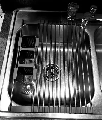 a washing machine sitting in a kitchen sink at Incredible Equipped Yurt Amazing for a Glamping Experience in East Meredith, New York in East Meredith