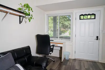a room with a desk and a chair and a door at Croton Nook - Cozy Getaway in Croton-on-Hudson