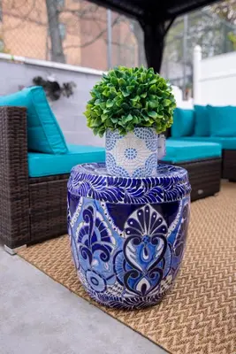 a blue and white vase with a plant in it at Lovely 1 bedroom apt with patio by Yankee Stadium in Melrose