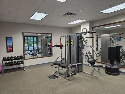 a fitness room with a gym with tread machines at The Appalachian Hotel at Mountain Creek Resort - Pool, Hot Tub & Sauna in Vernon Township