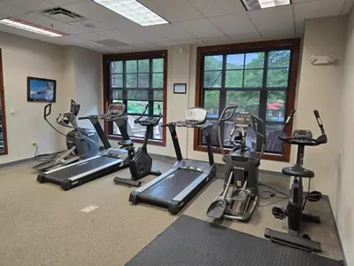 a gym with several treadmills and elliptical machines at The Appalachian Hotel at Mountain Creek Resort - Pool, Hot Tub & Sauna in Vernon Township