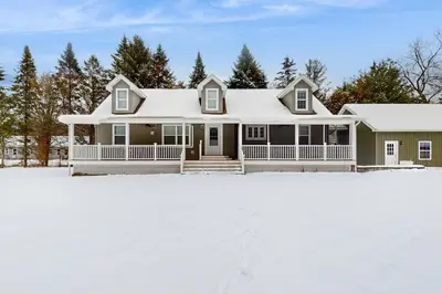 a house with snow on the ground at Stargazing Daydreamer in Arlington