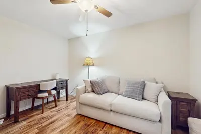 a living room with a couch and a desk at Stargazing Daydreamer in Arlington