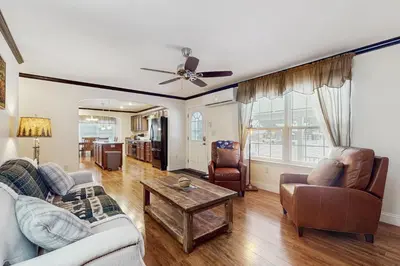 a living room with a couch and chairs and a table at Stargazing Daydreamer in Arlington