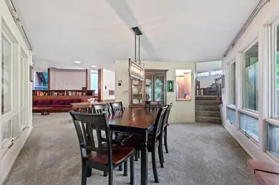 a dining room with a table and chairs at Nature's Retreat 4-Bedroom Cabin in Honesdale