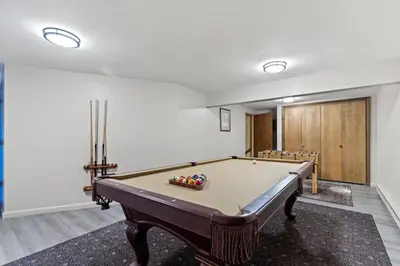 a room with a pool table in a room at Nature's Retreat 4-Bedroom Cabin in Honesdale