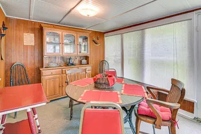 a dining room with a table and chairs at Private Dock Lakefront Gem on Saratoga Lake in Saratoga Springs