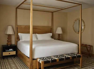 a bedroom with a large white bed with a canopy at Belden House & Mews in Litchfield