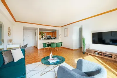 a living room with a couch and a tv at Contemporary 2 Bed 2 Bath Apt Bright and Sunny in New York