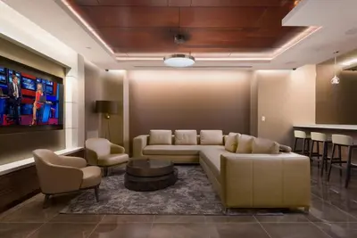a living room with a couch and a table and chairs at Luxury 2 Bed 2 Bath Unit in Prime Location of NYC in New York