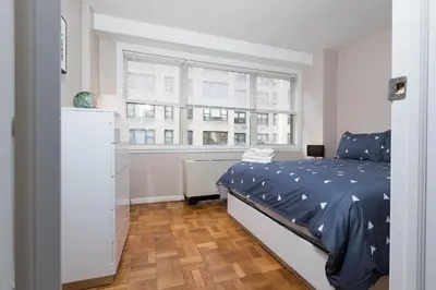 a bedroom with a bed and a window at 2 Bed Apt Ideally located in UES of Manhattan in New York