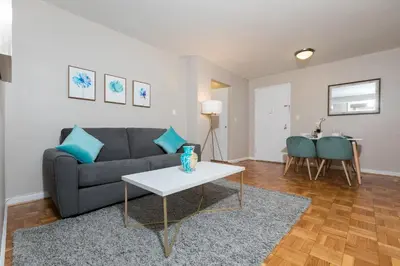 a living room with a couch and a table at 2 Bed Apt Ideally located in UES of Manhattan in New York