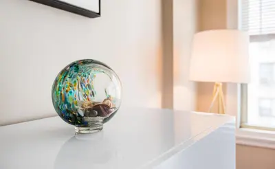 a glass ball sitting on top of a white table at 2 Bed Apt Ideally located in UES of Manhattan in New York