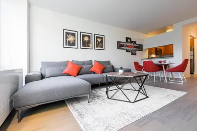 a living room with a couch and a table at Beautiful 1 Bed Fully Furnished Apartment in New York