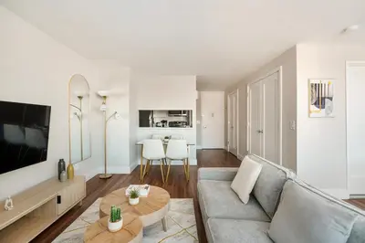 a living room with a couch and a table at Gorgeous Studio Apartment in New York
