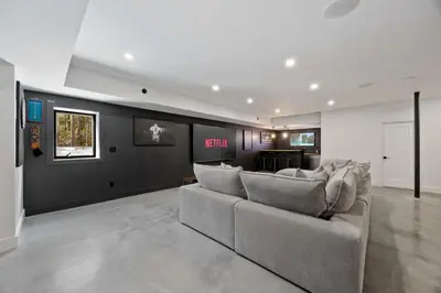 a living room with a couch and a kitchen at The Windham A in Windham