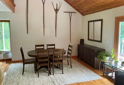 a dining room with a table and chairs at Copake Lakes Hidden Treasure in Copake