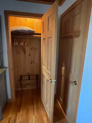 an open door in a room with a closet at Copake Lakes Hidden Treasure in Copake