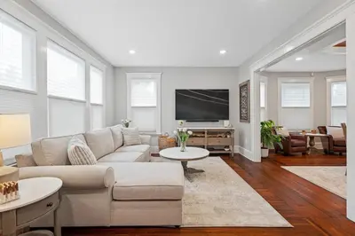 a living room with a couch and a tv at Red Cross Haven in New Haven