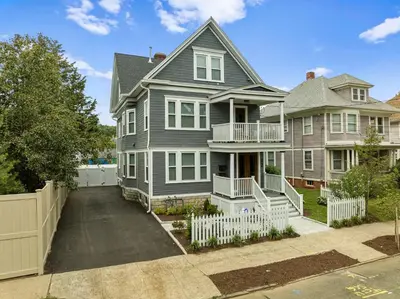 a large house with a white fence in front of it at Red Cross Haven in New Haven