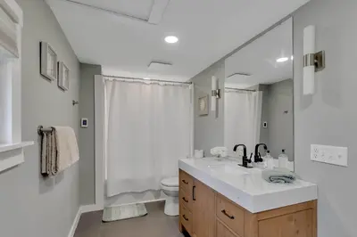 a bathroom with a sink and a toilet at Charming Family Saratoga Home Walk to Track & Downtown in Saratoga Springs