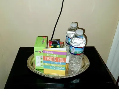 a tray with books and water bottles on a table at Whitney Wonder 2nd and 3rd floor in Hartford