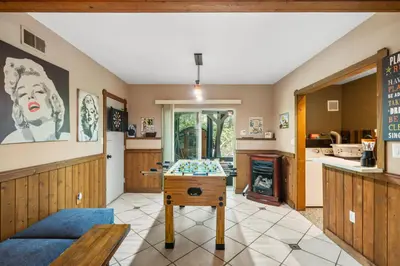 a living room with a table and a kitchen at Hideaway Hot Tub Sunna Lake Kayaks Pool in Bushkill
