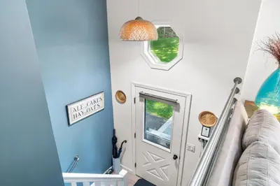 a hallway with a white door and a window at Hideaway Hot Tub Sunna Lake Kayaks Pool in Bushkill