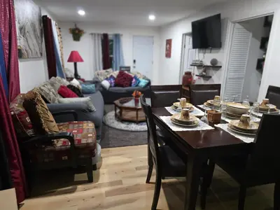 a living room with a table with food on it at Charming 3 bedroom 2 bath home in Bloomfield with wishing well in Bloomfield
