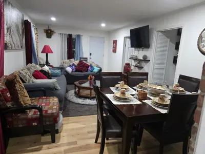 a living room with a table with food on it at Charming 3 bedroom 2 bath home in Bloomfield with wishing well in Bloomfield