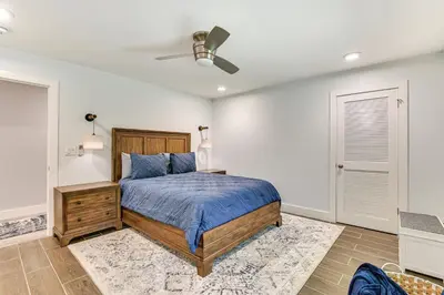 a bedroom with a bed and a ceiling fan at Fish and Swim Home with Catskill Creek Views! in East Durham