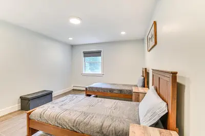 a bedroom with two beds and a window at Fish and Swim Home with Catskill Creek Views! in East Durham