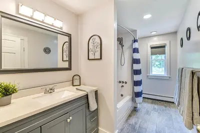 a bathroom with a sink and a shower at Fish and Swim Home with Catskill Creek Views! in East Durham