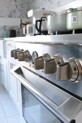 a stove with pots and pans on top of it at Santa Cruz rooms and hospitality