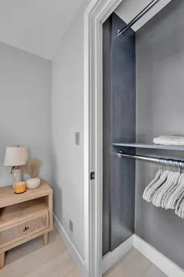 a walk in closet with a glass door at SoHo Designer 2BR with balcony in New York