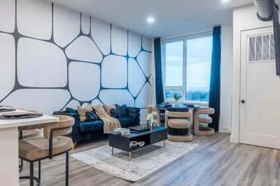 a living room with a couch and a table at Luxury Lookout with NYC view, 2BR plus Free Parking, Sleeps 8, 20 Percent Off in East Orange