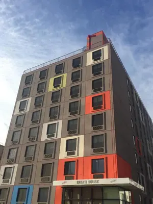 a tall building with many windows on top of it at Bklyn House Hotel New York Brooklyn in Brooklyn