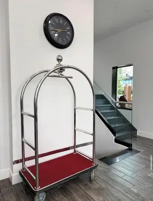 a stair case with a clock and a glass case at Bklyn House Hotel New York Brooklyn in Brooklyn