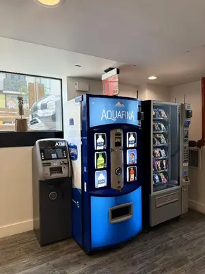 a atm and a ticket machine in a store at Bklyn House Hotel New York Brooklyn in Brooklyn