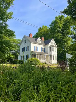 a large white house with a yard with trees at Charming Three Bedroom Retreat House in Saugerties