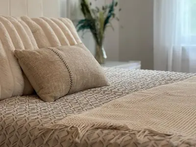 a bed with two pillows on top of it at Charming Three Bedroom Retreat House in Saugerties