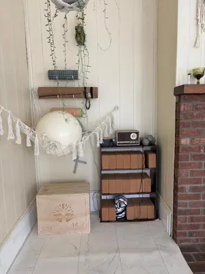 a corner of a room with a box and a clock at Charming Three Bedroom Retreat House in Saugerties
