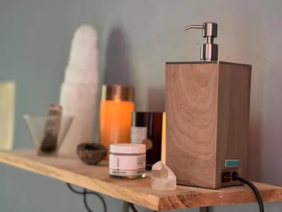 a wooden soap dispenser sitting on a shelf at Charming Three Bedroom Retreat House in Saugerties