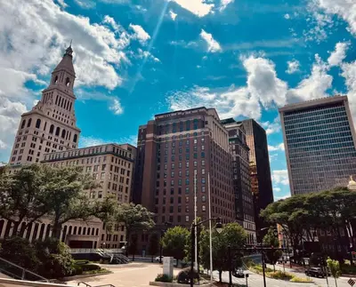 a group of tall buildings in a city at City Charm Walk to Trinity & Hospital with Parking in Hartford