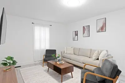 a living room with a couch and a coffee table at 15m to NY Cozy Relaxing Home in Hackensack