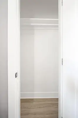 an open door in a room with a wooden floor at 3 Bedrm Apt at Black Rock Suites in Bridgeport