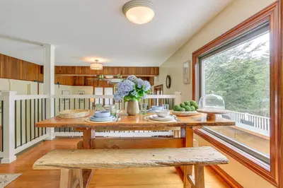 a dining room with a table and a window at 13 Mi to Ski Big Bear Updated Getaway with Deck in Shohola